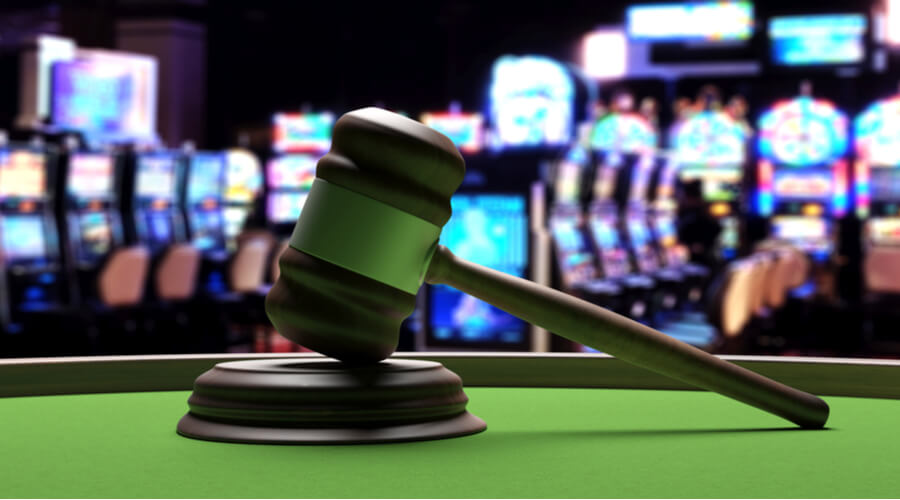 Online Gambling Laws and Regulation judge gavel on poker table